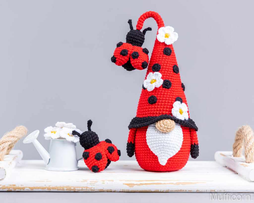 Crochet ladybug gnome standing on table
