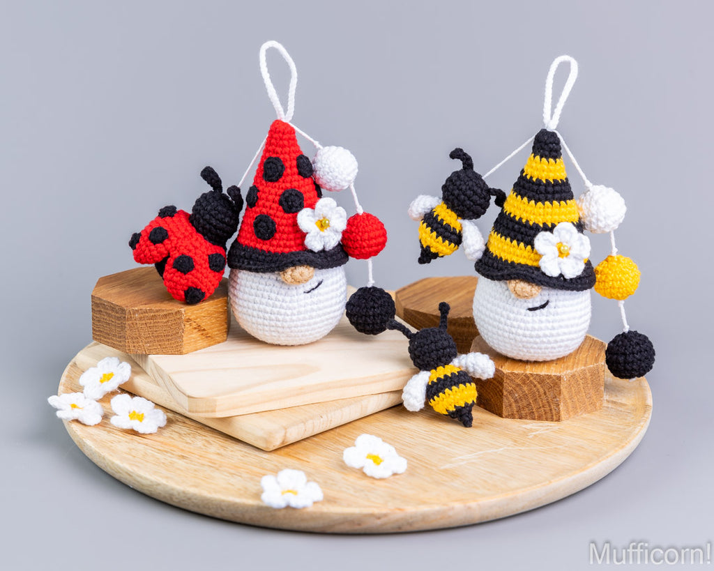 Ladybug and bee gnome keychains side angle on table
