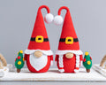 Mr and Mrs Santa gnome crochet pattern on tray with Christmas trees