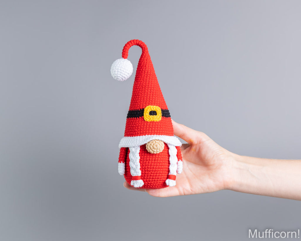 Crochet Mrs Santa gnome amigurumi held in hand