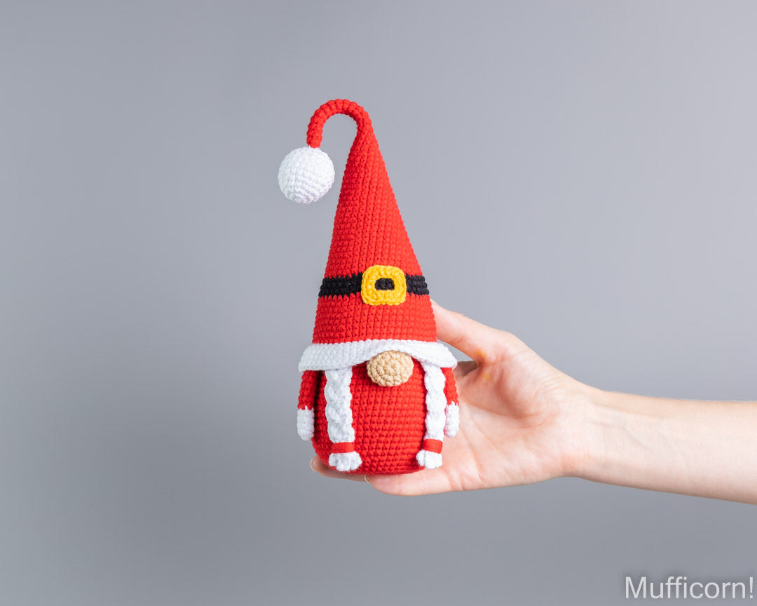 Crochet Mrs Santa gnome amigurumi held in hand