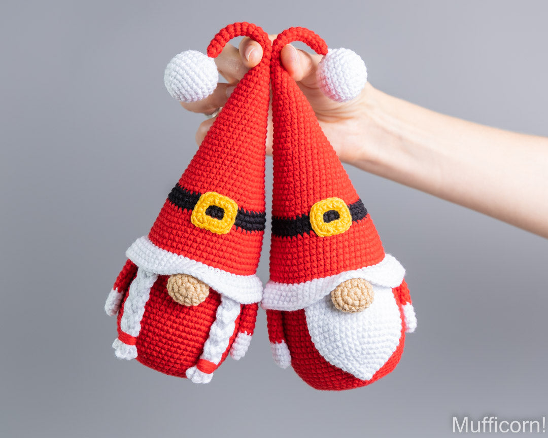 Mr and Mrs Santa gnome crochet pattern held together in hand