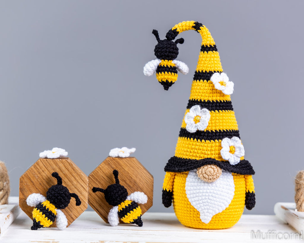 Crochet bee gnome standing on tabl
