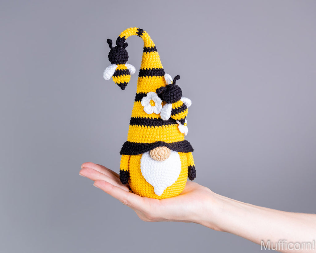 Crochet bee gnome held in hand