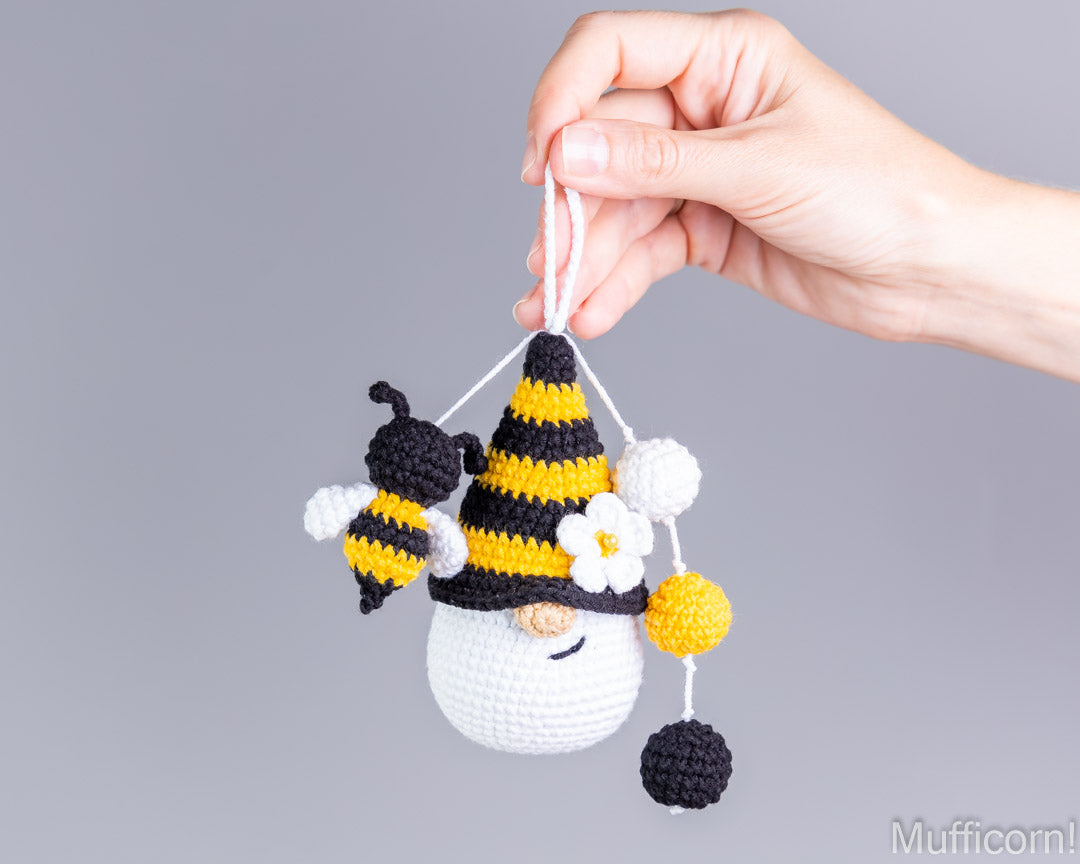 Crochet bee gnome keychain hanging in hand