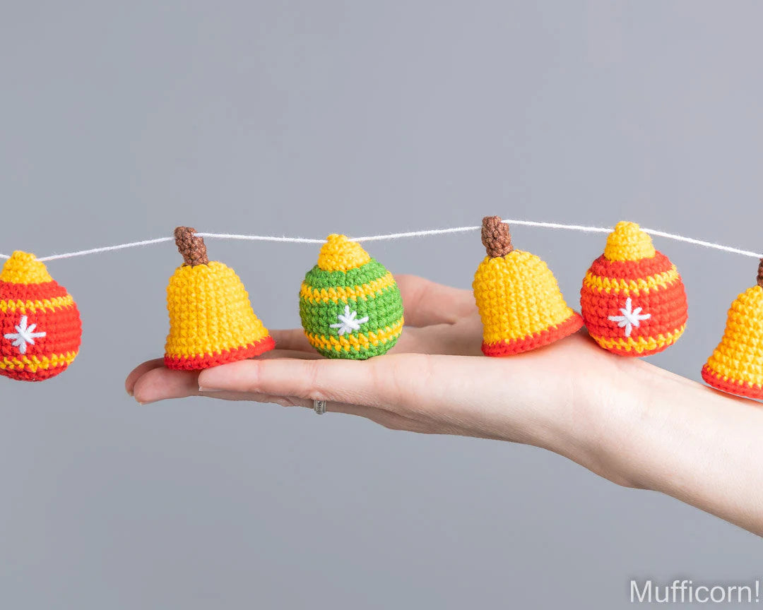 Crochet Christmas ball ornaments held in hand