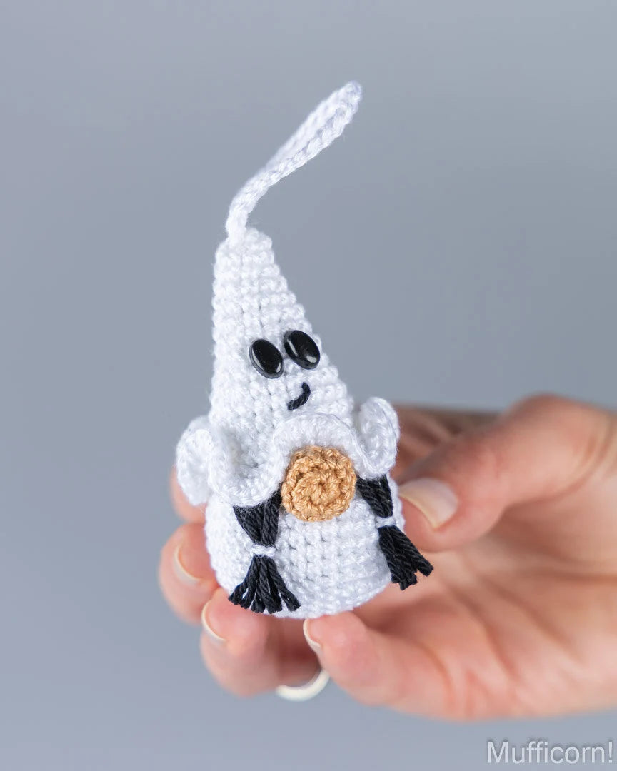 Crochet girl ghost gnome keychain held in hand