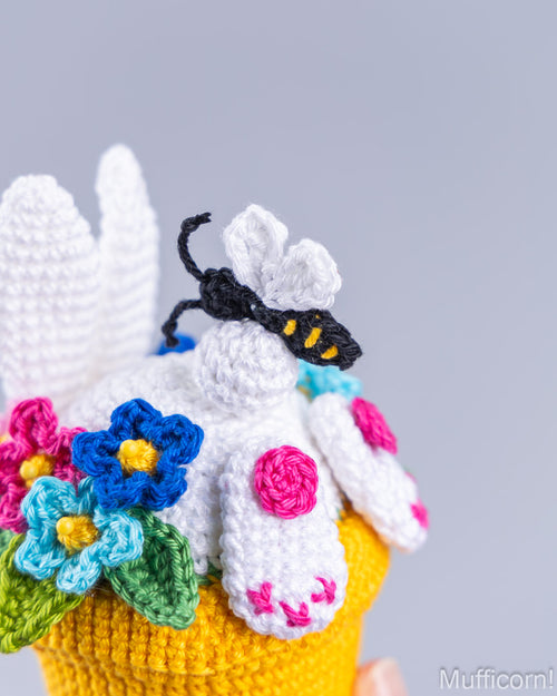 Crochet bee detail on bunny tail close-up