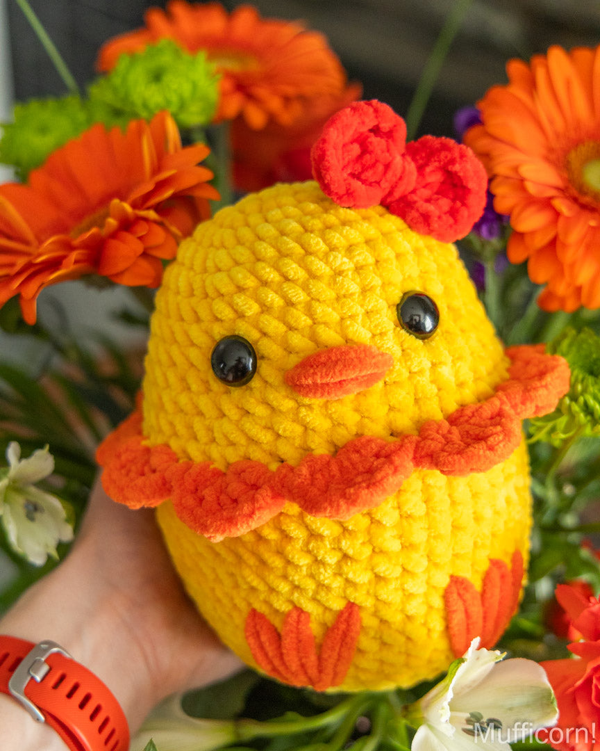 Plush duck in persons hand
