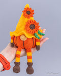 Pumpkin gnome amigurumi close-up held in hand