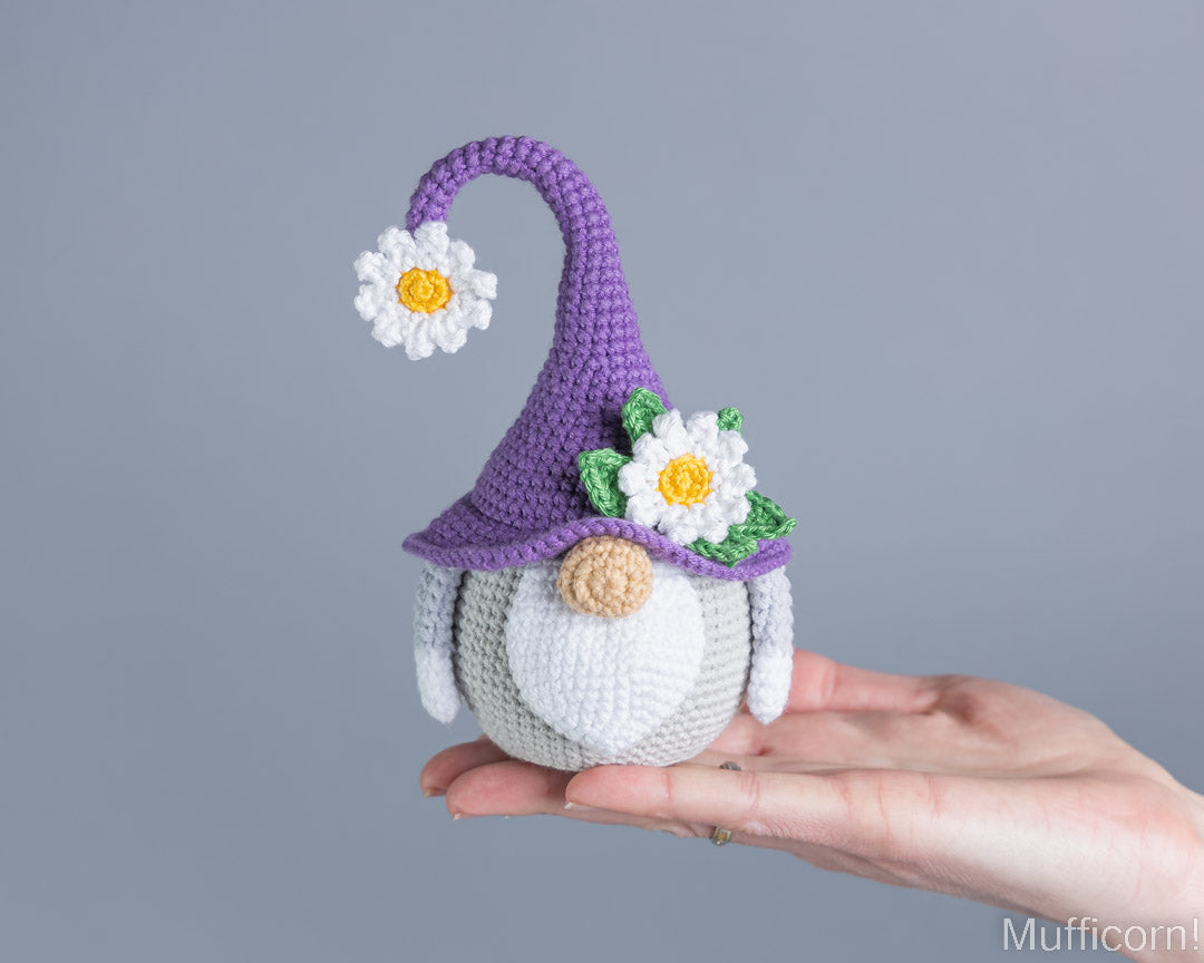 Daisy gnome crochet pattern held in hand